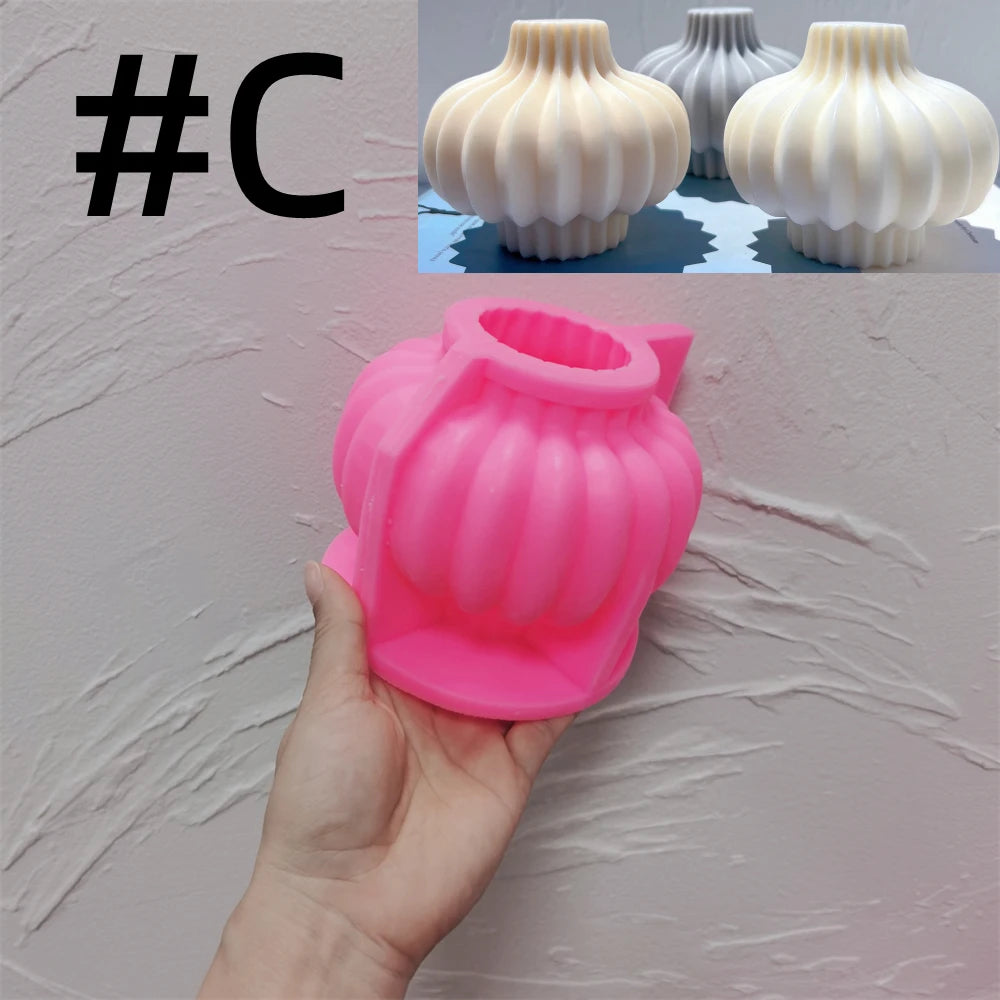 Pink silicone Round Bulb C mold held in a hand