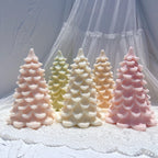 Four scalloped tree castings with broad lower branch layers