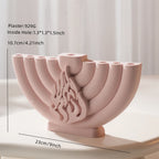 Pink casting of a nine-branched menorah with dimension callouts and candle sockets