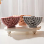 Semicircular menorah relief castings with central flame motifs
