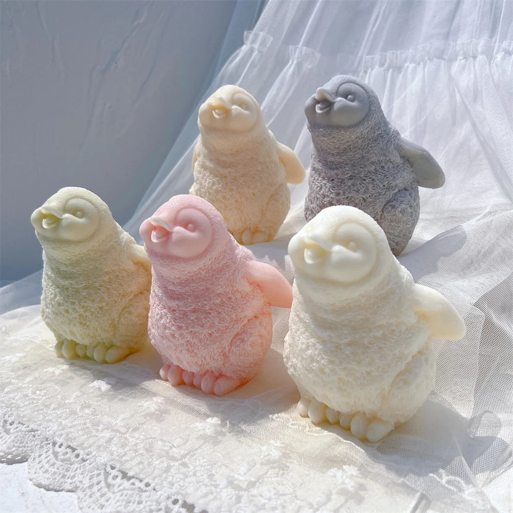 Angled view of textured penguin candle examples