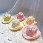 Pink, cream and yellow decorated hat castings