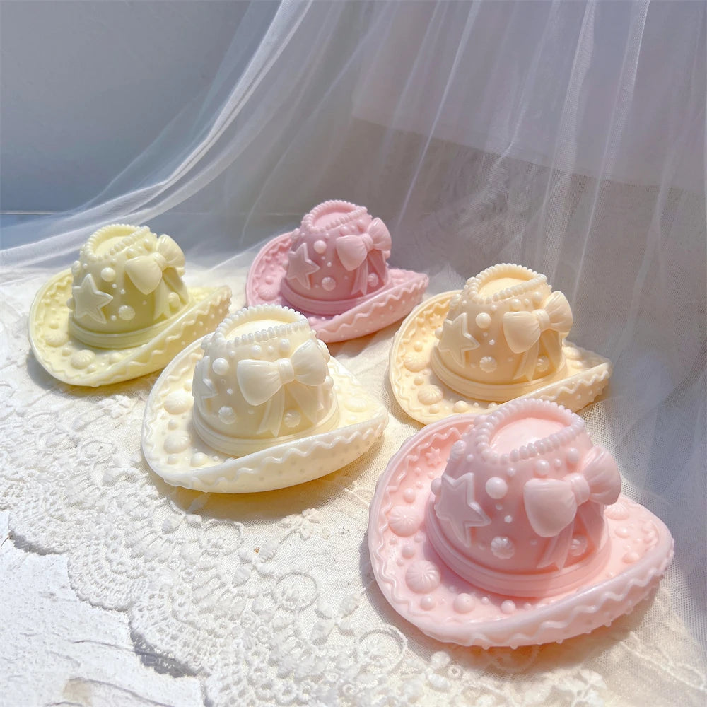 Pink, cream and yellow decorated hat castings