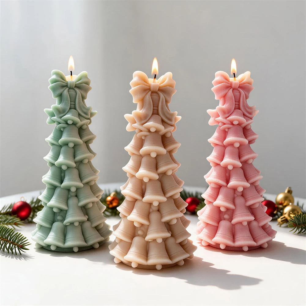Pastel bell-shaped Christmas tree candles with bows at the top