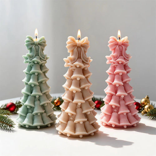 Pastel bell-shaped Christmas tree candles with bows at the top