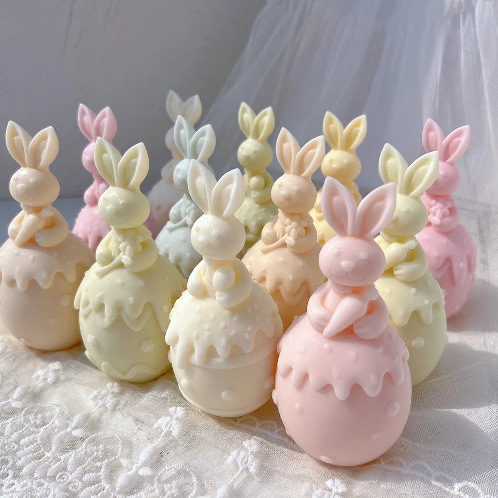 Front view of bunny figures on smooth dotted and floral eggs