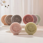Pastel round medallion castings displayed upright in a group