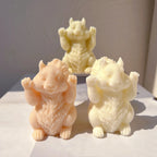 Squirrel castings with raised paws in pale orange and ivory wax