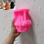 Pink ghost cupcake silicone candle mold held in one hand