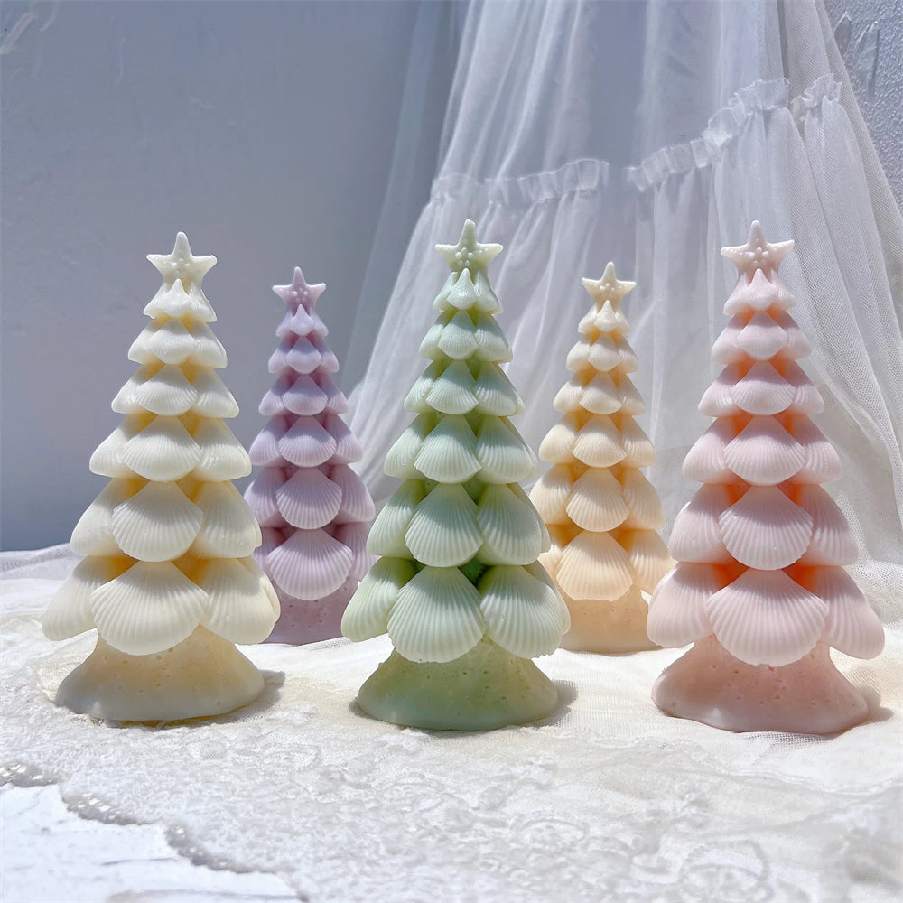 Pastel star-topped tree candles with layered fan-shaped branches