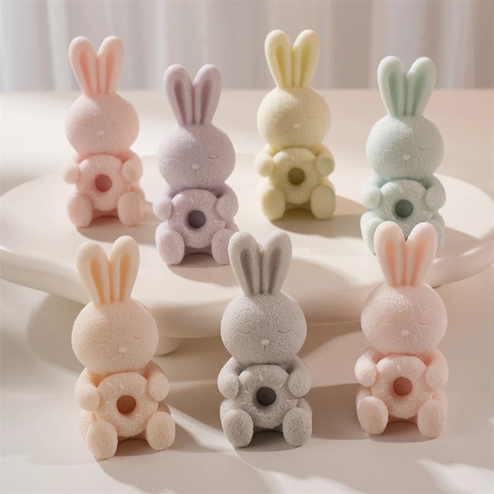 Sleepy bunnies holding round-petal flowers