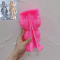 Pink silicone mold for the standing praying angel held open