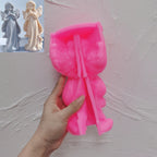 Pink silicone mold for the standing praying angel held open