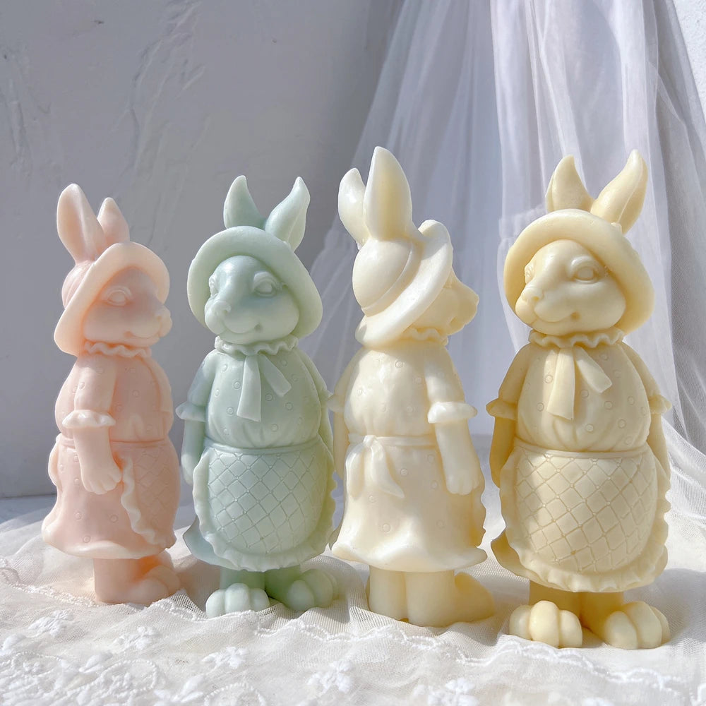 Pastel rabbit figurine castings wearing bonnets and aprons