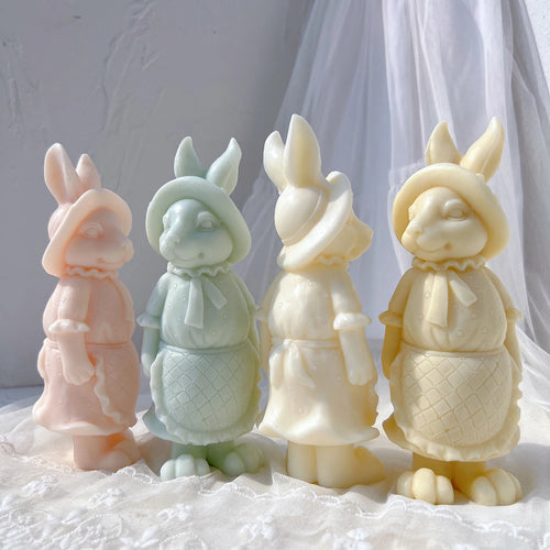 Pastel rabbit figurine castings wearing bonnets and aprons