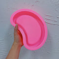 Second view of the pink organic tray mold and recessed cavity