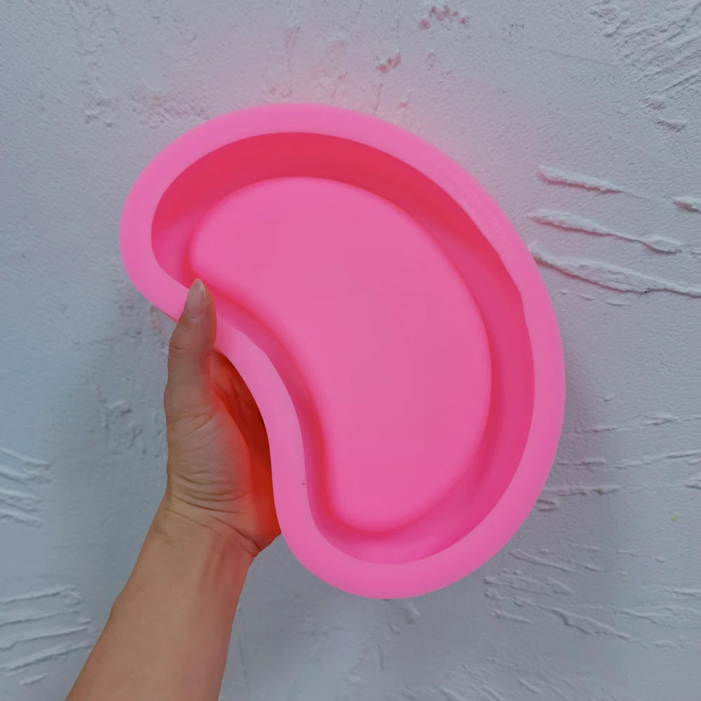 Second view of the pink organic tray mold and recessed cavity