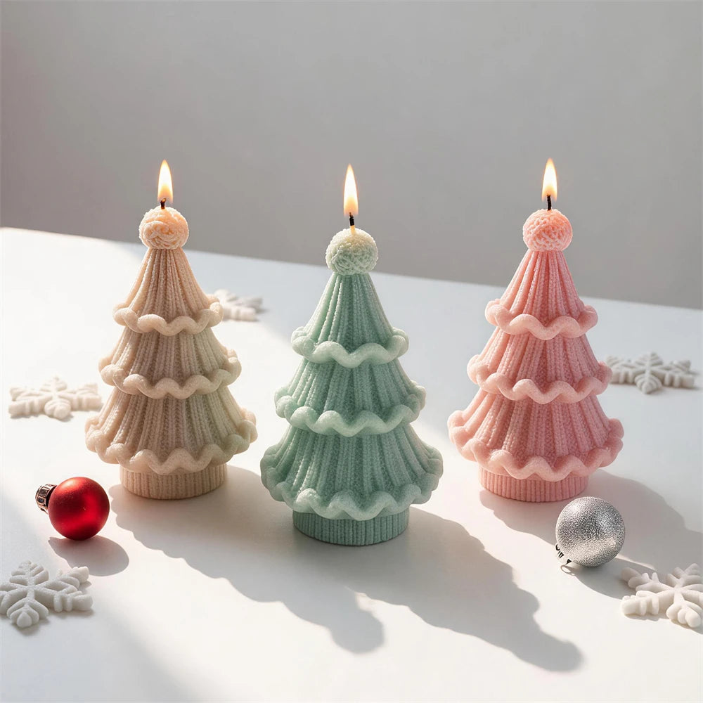 Three pastel tree castings with scalloped knit tiers