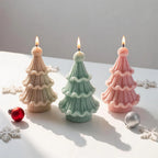 Three pastel tree castings with scalloped knit tiers