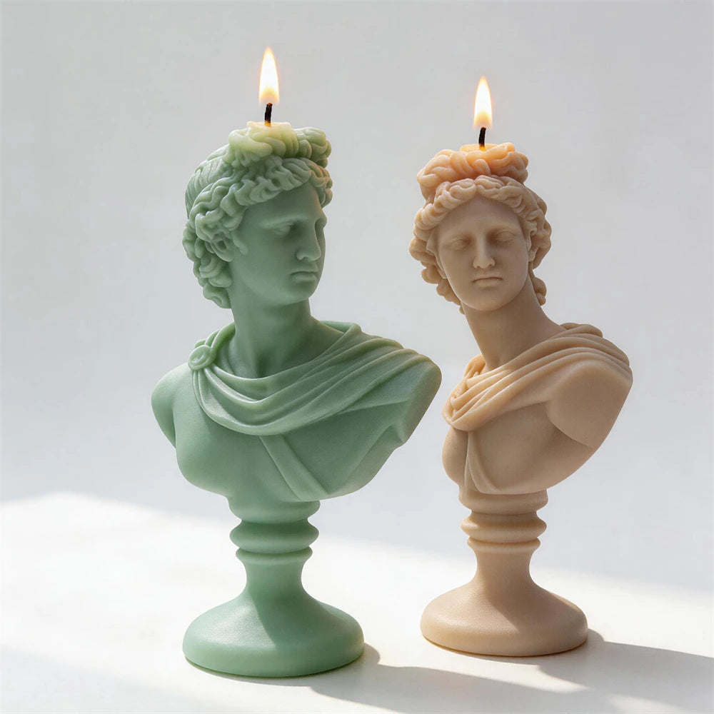 Front three-quarter view of green and cream classical bust candles