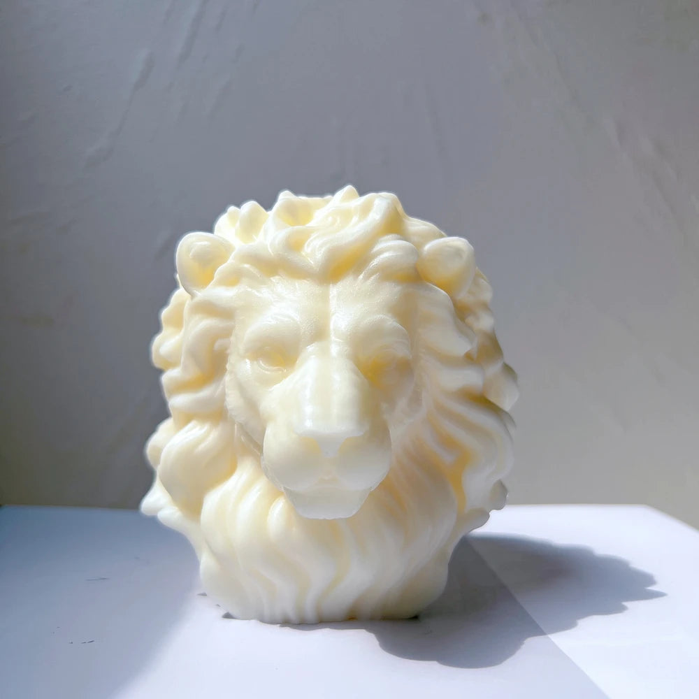 Front close-up of light-colored lion-head casting with wavy textured mane