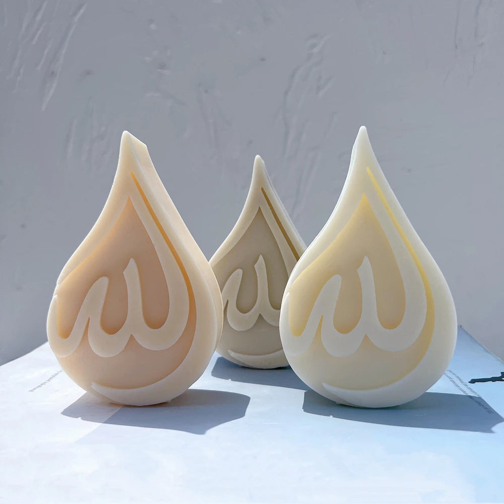 Allah inscription reliefs in pointed teardrop frames