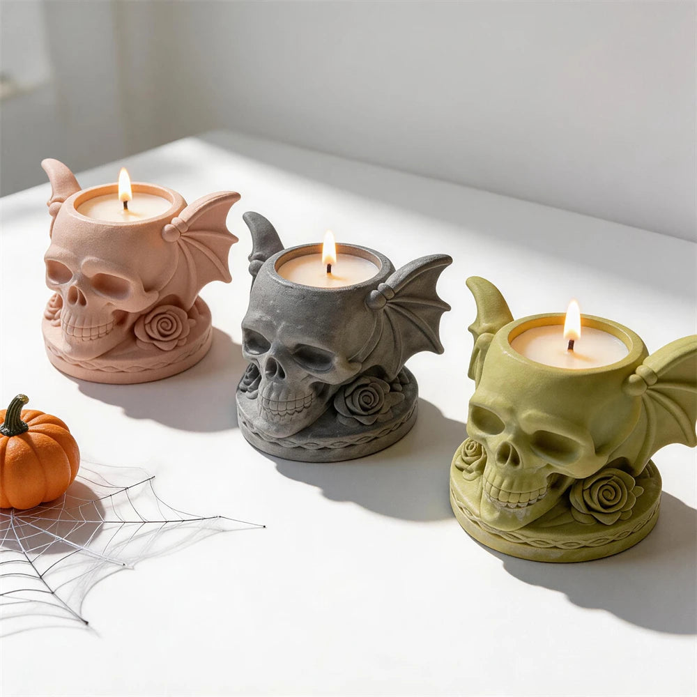 Angled view of rose skull holders with bat-wing sides