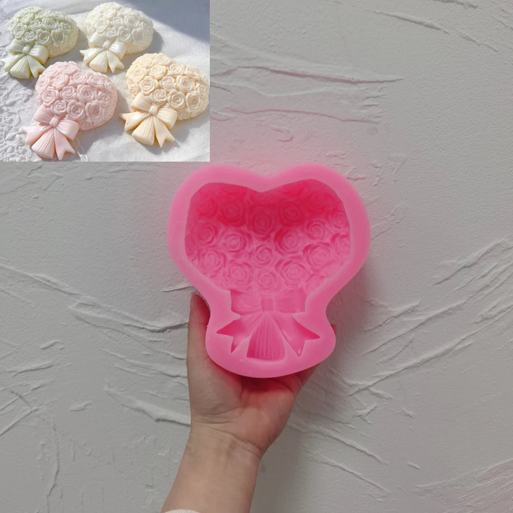 Pink silicone rose bouquet and bow mold held in a hand