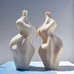 Side view of ivory sculptural candle forms