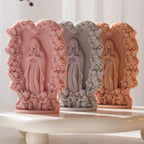 Three floral devotional relief castings together