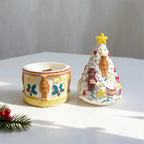 Decorated cylindrical vessel beside detached Christmas tree lid