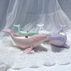Pastel whale holder castings with sculpted faces and side fins