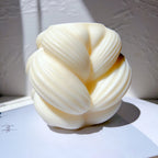 Angled view of Large braided-swirl casting