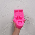 Pink cat holder silicone mold showing the open belly and cup-forming area
