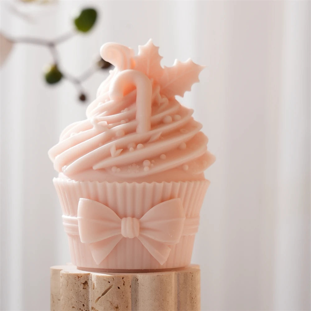 Close-up of bow-front cupcake with swirled top decoration