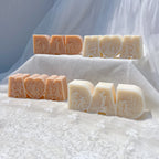 Decorative DAD lettering and heart-centered MOM designs on white fabric