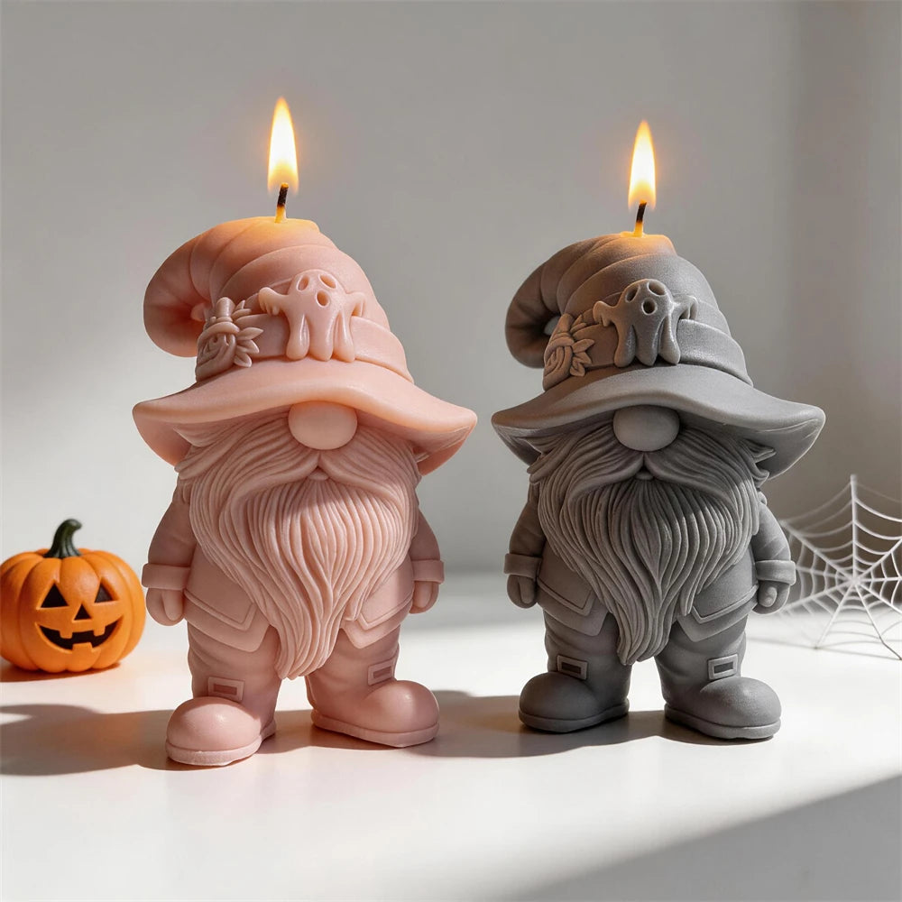 Pink and gray bearded gnome candles with ghost-decorated curled hats