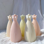 Pastel gown candle castings with fitted bodices and pleated skirts