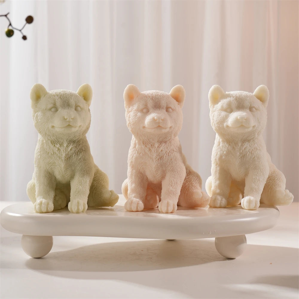 Three Shiba Inu candle samples on a small display stand