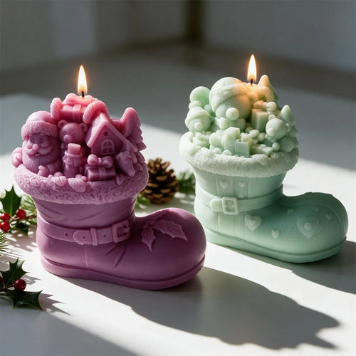 Cottage-scene boot candles in purple and green with buckle and holly details
