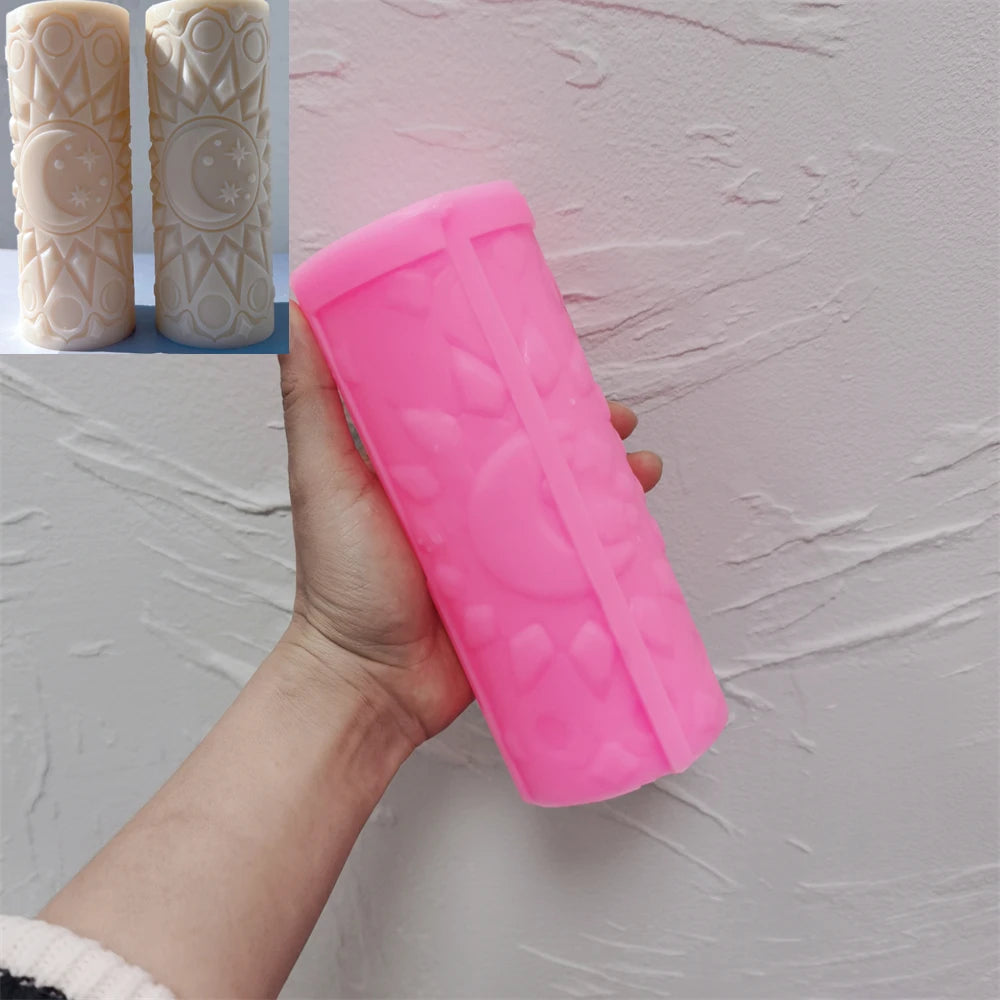 Pink moon mandala silicone pillar mold held beside finished castings