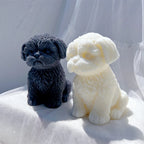 Dark and cream puppy castings showing rounded front paws