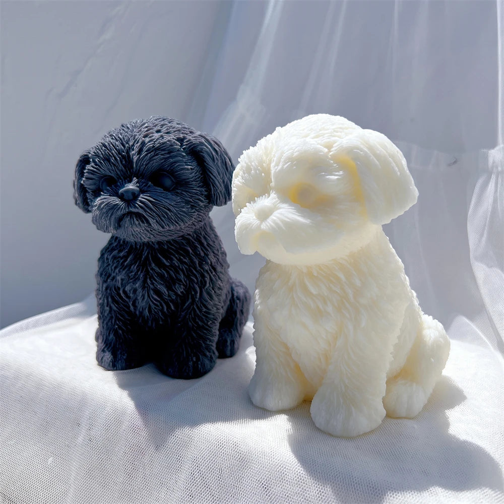 Dark and cream puppy castings showing rounded front paws