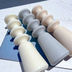 Three stacked-disc castings lying side by side
