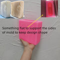 Pink silicone block mold with diagram showing flat side supports