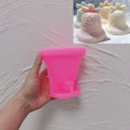 Pink silicone mold for rounded gingerbread holiday bell design