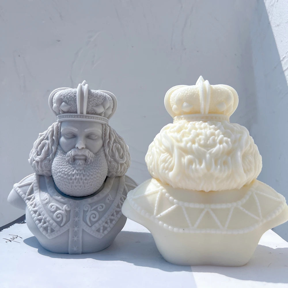 King bust pair showing curled hair and decorated collars