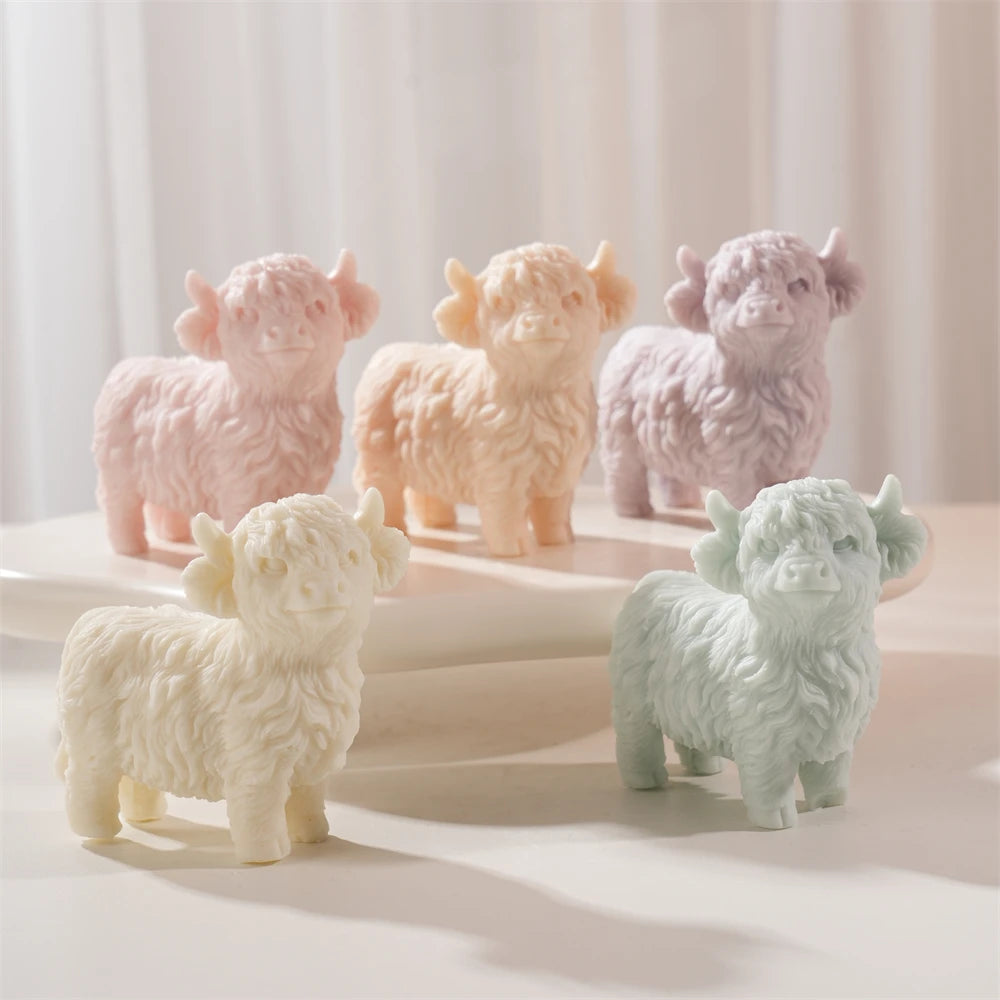 Five Highland cow candle samples in pastel colors