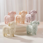 Five Highland cow candle samples in pastel colors