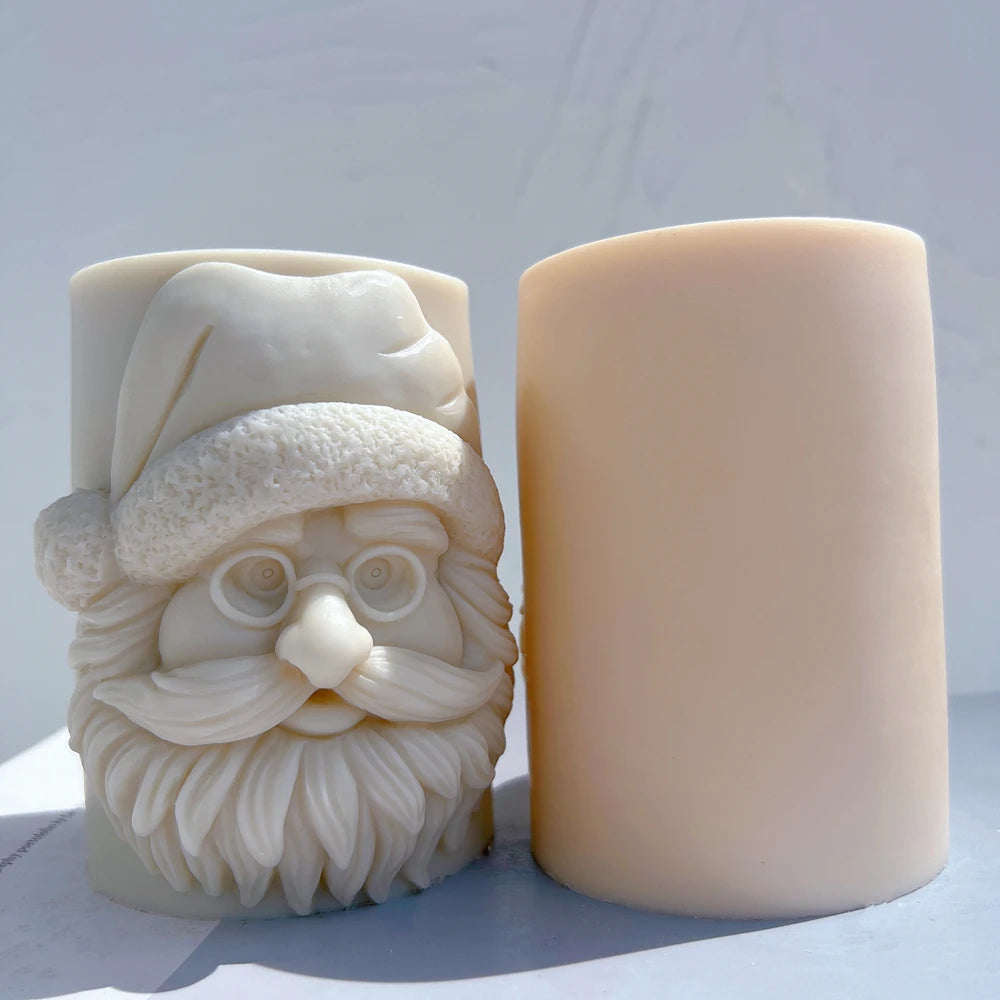 Front relief and smooth rear of Santa pillar candles
